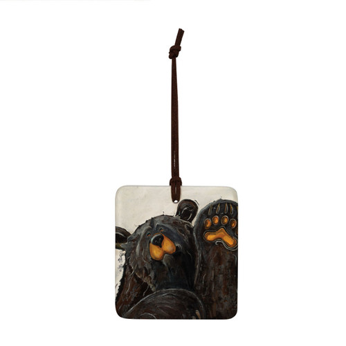 A square ceramic hanging ornament with a painting of a waving black bear.