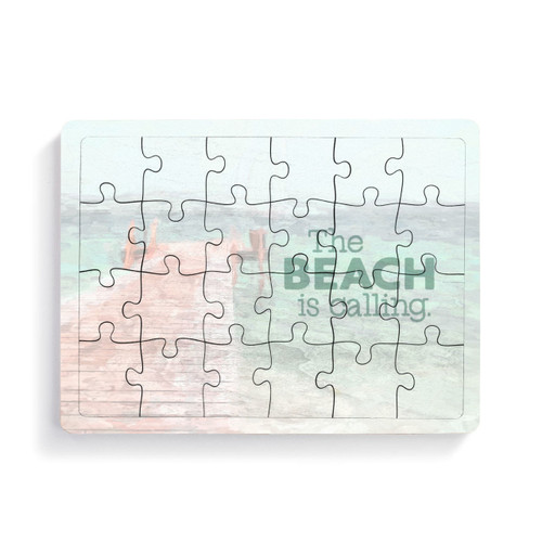 A 24 piece postcard puzzle with a lake pier scene that says "The Beach is calling".