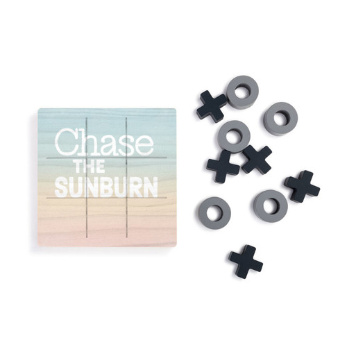 A square wood board for tic tac toe in sunset colors that says "Chase the Sunburn", next to a set of X's and O's in gray and black.