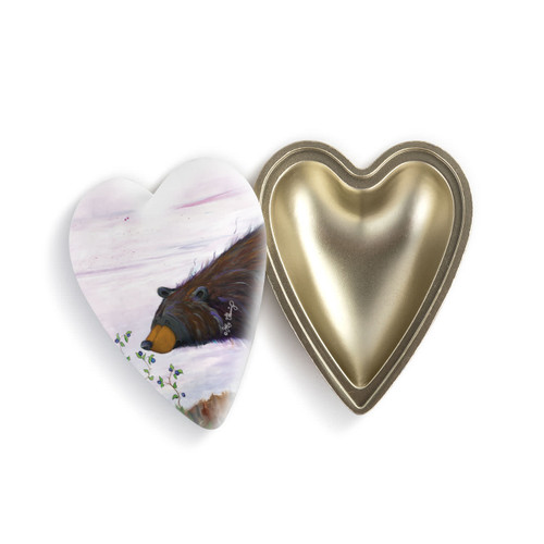 Heart shaped keeper box with a painted scene of a black bear sniffing huckleberries on the lid, shown with the lid offset to the base.