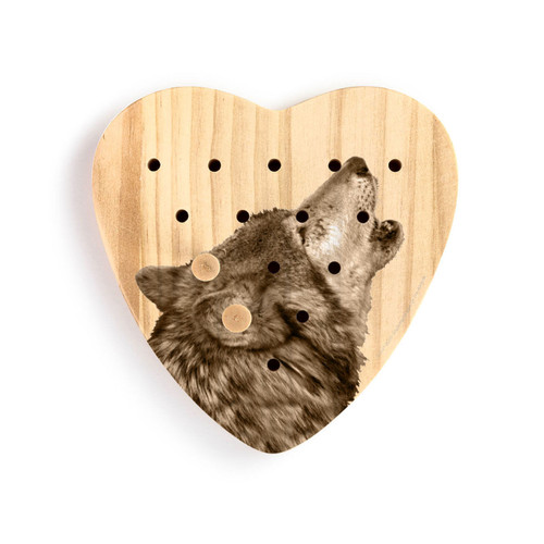 A heart shaped wood peg game that has the image of a wolf, shown with two wood pegs in it.