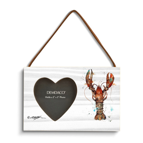 A rectangular wood hanging frame with a heart shaped 2 inch photo opening next to a watercolor image of a lobster.