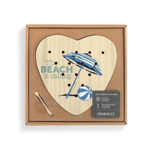 A light yellow heart shaped wood peg game with a beach ball and umbrella with the saying "The Beach is calling", shown in a cardboard packaging box with a product information tag.