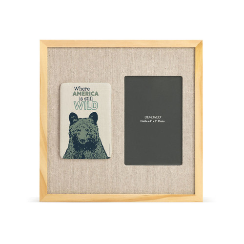 A light wood frame with a tile on the left with a bear and the saying "Where America is still Wild" next to a 4x6 photo opening on a linen background.