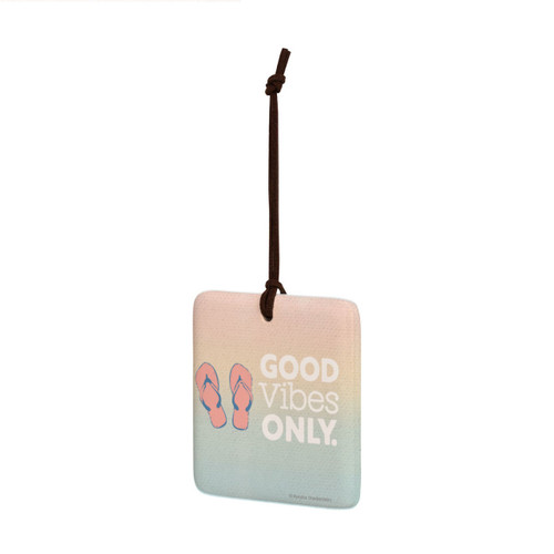 A square hanging ornament with a pair of flip flops that says "Good Vibes Only" on a pastel background angled to the left.
