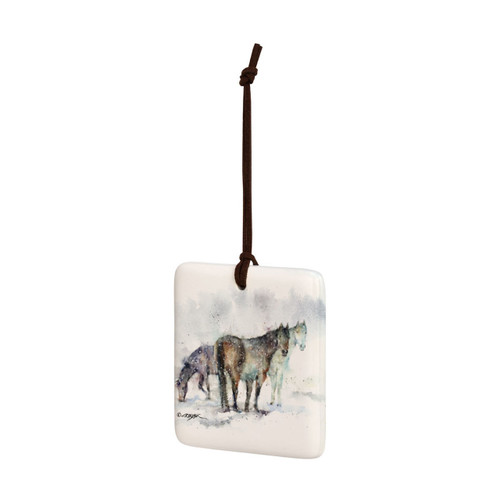 A square hanging ornament with a watercolor image of three horses, displayed angled to the left.