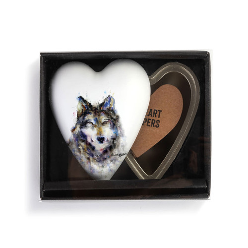 Heart shaped keeper with a watercolor image of a wolf face on the lid, displayed in a packaging box.