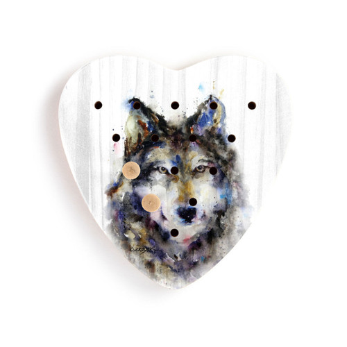 A heart shaped wood peg game with a watercolor painting of a wolf face, with two wood pegs in it.