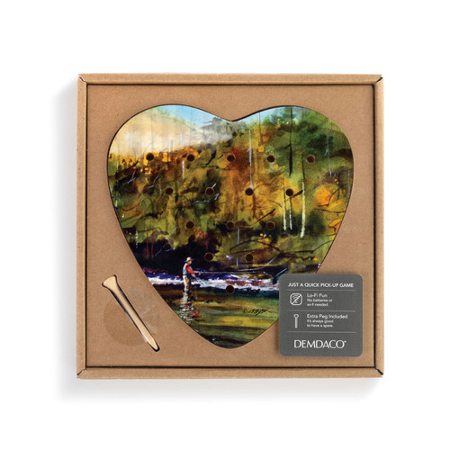 A heart shaped wood peg game with a watercolor painting of a fly fisher in the river, displayed in a packaging box with a product information tag.