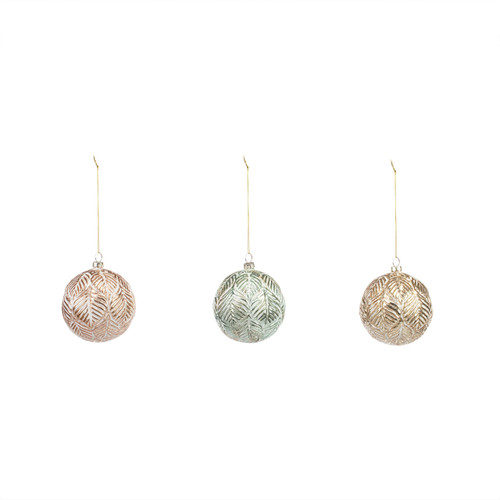 Three round textured metal Christmas ornaments in different colors of distressed metal.