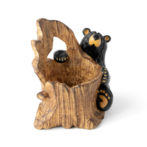 A sitting black bear behind a hollowed wood log that serves as a pencil holder, displayed angled to the right.