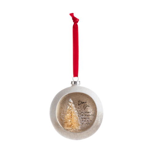 A silver ball ornament on a red ribbon with an opening at the front with a gold tree inside and a sentimental message about you.