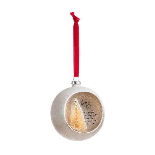 A silver ball ornament on a red ribbon with an opening at the front with a gold tree inside and a sentimental message about you, displayed angled to the right.