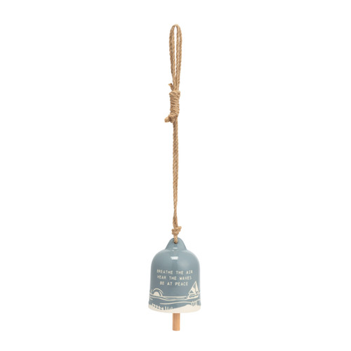 A gray-blue stoneware bell on a jute hanger with a ocean theme that says "Breathe the Air Hear the Waves Be at Peace".