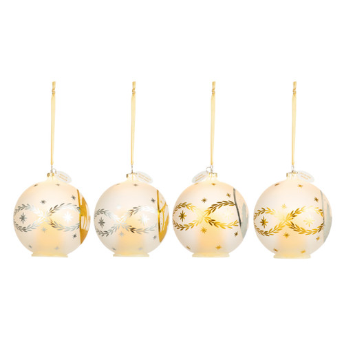 Profile view of four round hanging glass ornaments each with a different nativity scene on the front.