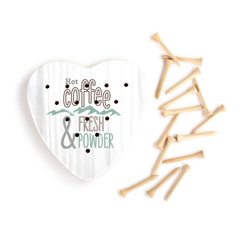 A white wood heart shaped peg game that says "Hot Coffee & Fresh Powder" with the light wood pegs to the side.