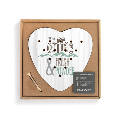 A white wood heart shaped peg game that says "Hot Coffee & Fresh Powder", displayed in a packaging box.