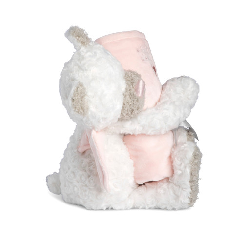 Right profile view of a white and brown teddy bear with pink angel wings holding a soft pink rolled blanket that says "A little angel sleeps here".