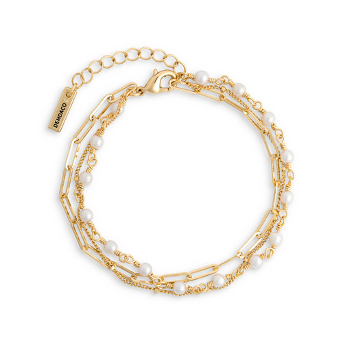 A multi-strand gold chain adjustable bracelet with small pearls attached to one of the strands.