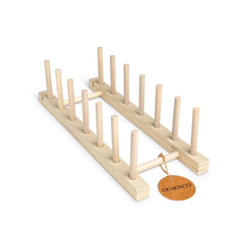 A light wood slotted stand with seven upright pegs on each side, displayed with a product tag attached.
