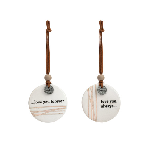 A set of two white hanging round ceramic ornaments with metal tokens that say "daughter" and "mother". One ornament says "love you forever" and the other says "love you always".