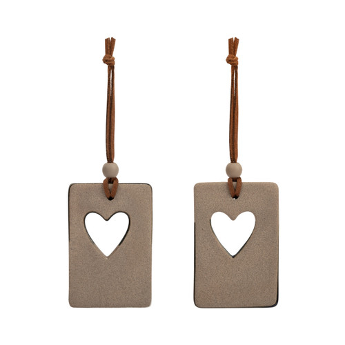 Backside view of a set of two hanging tan and dark blue ceramic ornaments with a heart cutout and metal tokens that say "grandkid" and "grandma". One ornament says "love you everywhere" and the other says "love you anywhere".