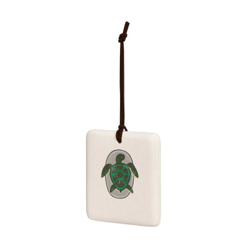 A square hanging tile ornament with a graphic image of a green turtle on a gray background, displayed angled to the left.