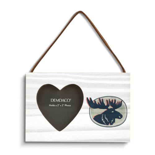 A rectangular hanging white wood frame ornament with a graphic image of a dark blue moose in profile and a 2x2 heart shaped opening for a photo.