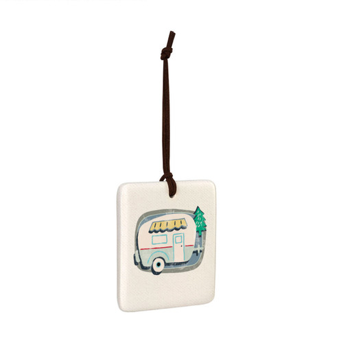 A square hanging tile ornament with a graphic image of a white camper on a blue and gray background, displayed angled to the right.