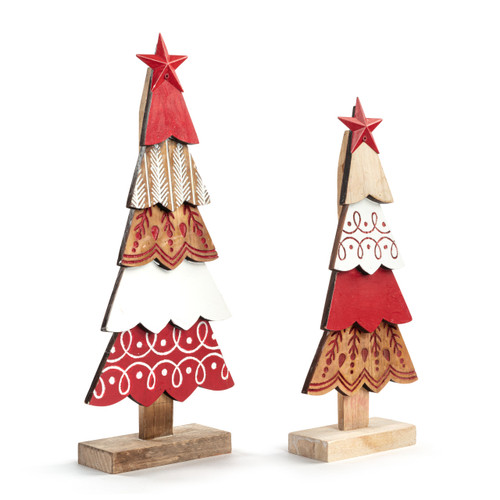 Two wood decorative trees with layered wood pieces with different designs and red and white colors. Each tree has a red star at the top, displayed angled to the right.