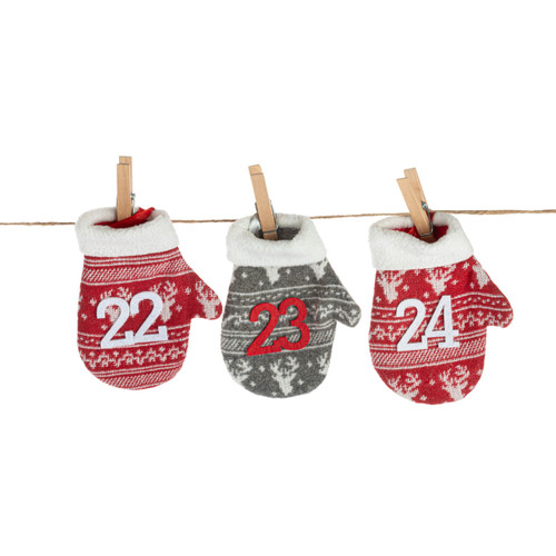 Detail view of three of the mittens on a hanging garland of red and green patterned mittens each with a number counting down the days to Christmas.