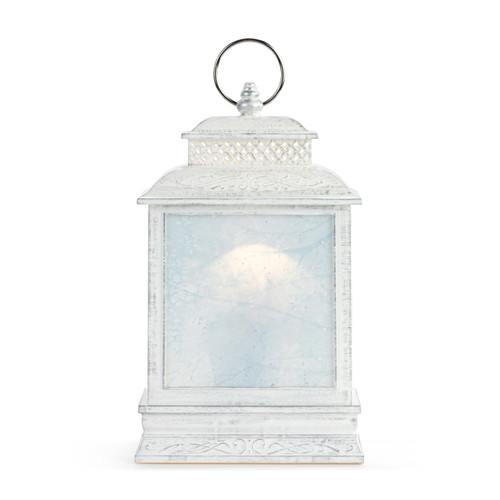 Back view of a white lit musical lantern with the image of a red cardinal on a branch inside.