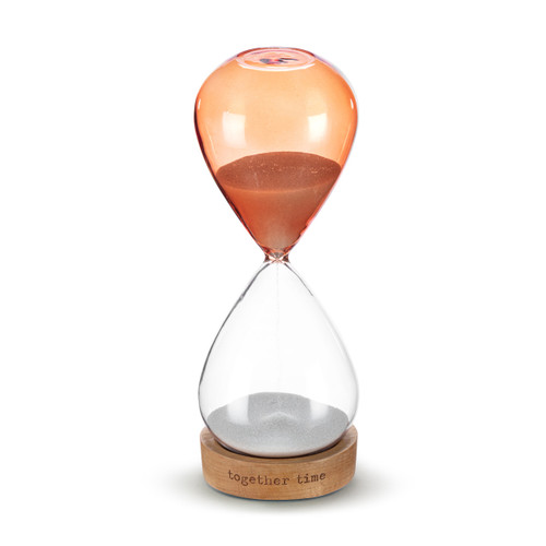 A glass sand timer with orange glass on the bottom half sitting in a wood base that reads "together time", displayed with the orange portion on top and the clear on the bottom.