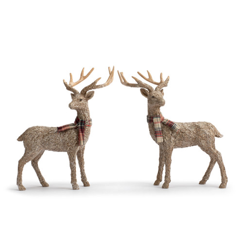 Two brown textured deer figurines wearing plaid scarves.