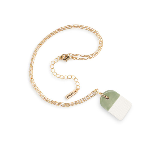 An adjustable gold chain necklace with a green and white diffuser charm, displayed laid out on a white background.