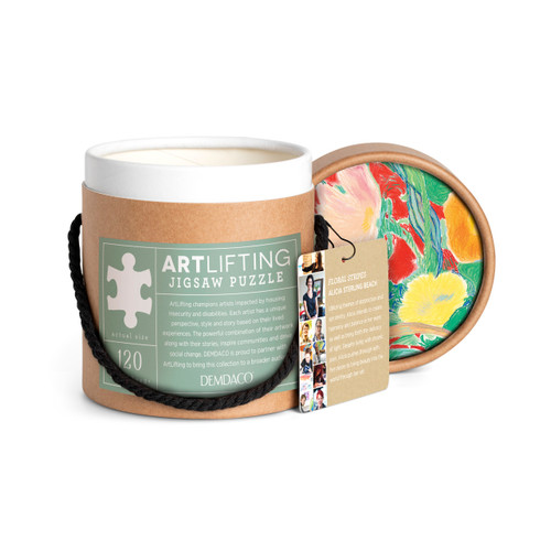 A brown cardboard packaging container with artwork and artist specific tag information for a 120 piece puzzle of a colorful contemporary vase of flowers on a red background, inspired by artwork created by ArtLifting artist Alicia Sterling Beach, displayed with the lid off and to the side.