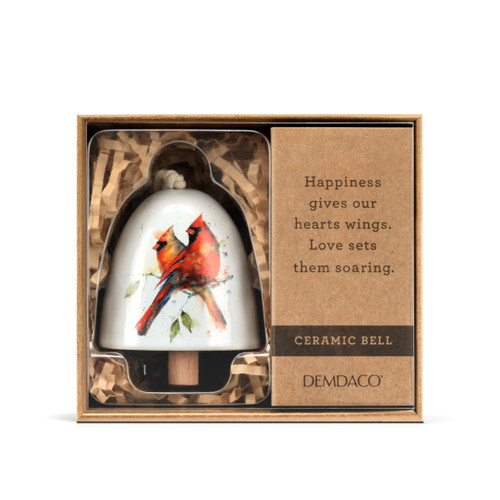 A white mini ceramic bell with a wood clapper. The bell has a watercolor image of a pair of cardinals on it, displayed in a brown packaging box.