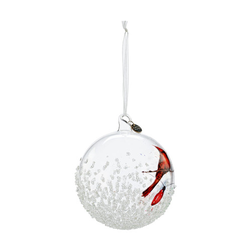 Right profile view of a clear glass ball ornament with an image of two cardinals sitting on a holiday string of lights.
