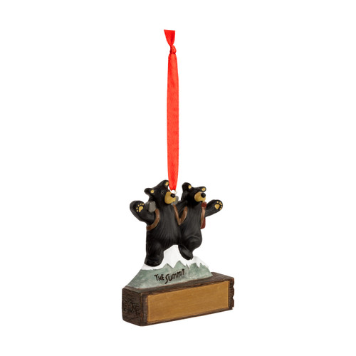 A hanging ornament of two bears at the summit of a mountain on a rectangular base that can be personalized, displayed angled to the right.