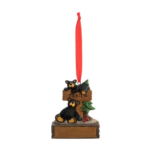 An ornament of two little black bears sitting at a "trail" sign, hanging from a red ribbon. There is a spot in front for customization.