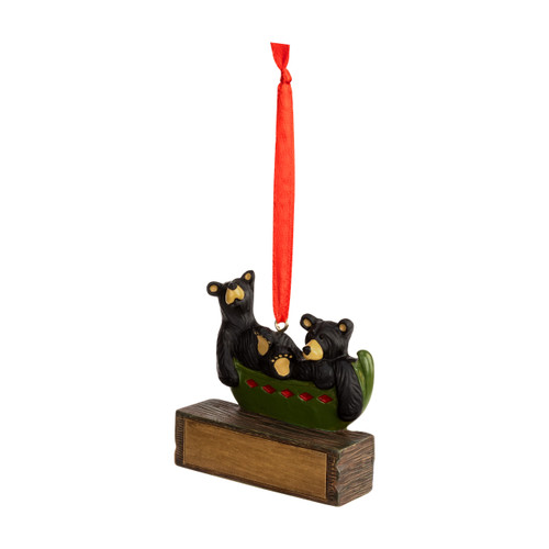 A hanging ornament with two black bears in a canoe on a rectangular base that can be personalized, angled to the left.