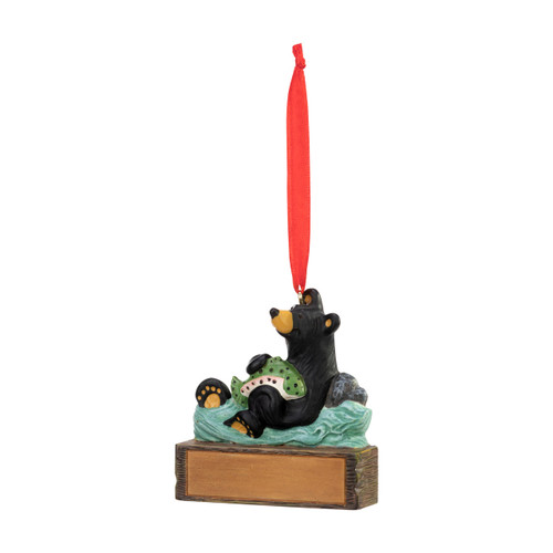 An ornament of a black bear in the water catching a fish, hanging from a red ribbon. There is a spot in front for customization, displayed angled to the left.