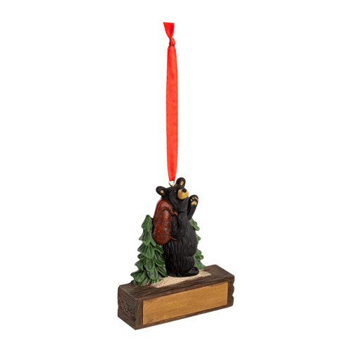 A hanging ornament with a black bear hiking on a rectangular base that can be personalized, displayed angled to the right.