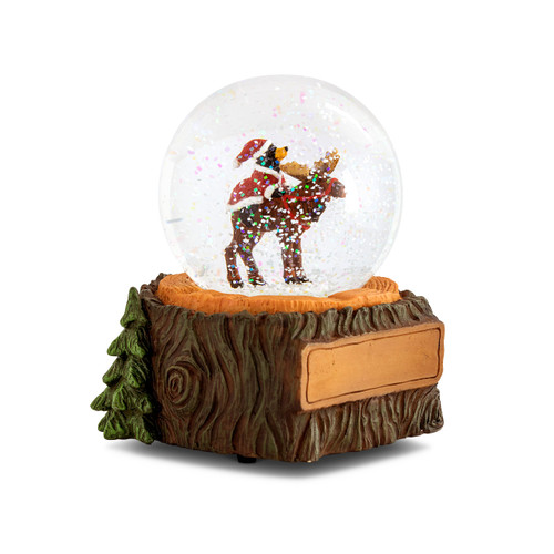 A musical snow globe with a figure of a black bear dressed as Santa riding on the back of a reindeer. The base looks like a tree stump with a place to personalize on the front, displayed angled to the right.