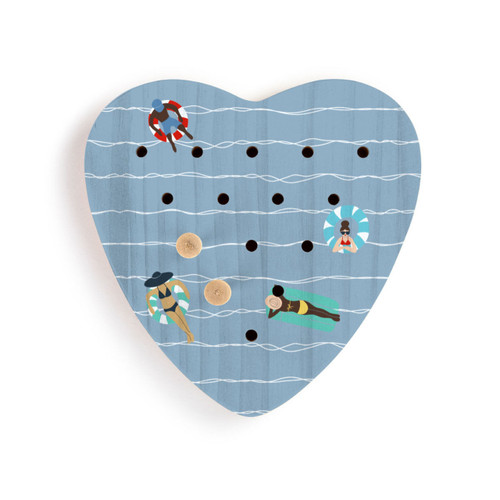 A blue wood heart shaped peg game with an illustration of people on floats in the water, displayed with two wood pegs in the game.