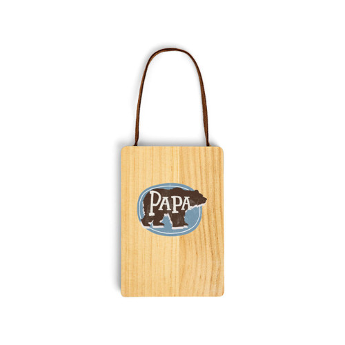 A wood hanging gift card ornament with an illustration of a bear silhouette that says "PAPA" on a blue background on the front. The back has a holder for a gift card.