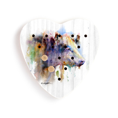 A white wood heart shaped peg game with a watercolor image of a cow, displayed with two wood pegs in the game.