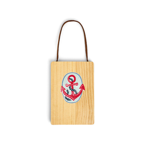 A wood hanging gift card ornament with an illustration of a red anchor on a light blue background on the front. The back has a holder for a gift card.