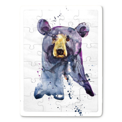A 24 piece puzzle postcard with the watercolor image of a black bear's face.