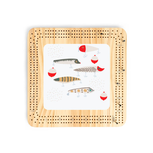 A light wood cribbage board with an illustration of fishing lures in the center.